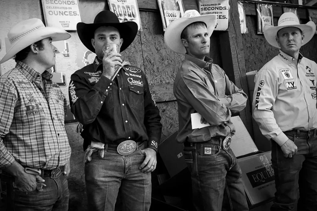 Western ranch competition photograph by Verne Rainey featuring riders waiting their turn in arena action